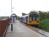 A very wet Blackpool South station sees Northern Pacer 142005, standing by the buffers, ready to leave on the 0844 service to Colne. This is the old Down Lytham platform. All the former railway land to the left of the fence is now used for car parks and roads as is the area behind the photographer continuing all the way to the former Blackpool Central station. <br><br>[Mark Bartlett 05/05/2009]