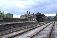 View east towards the train shed on the south side of Bishop Auckland station around 1977. The long demolished old station has since been replaced by a single platform terminus on the line from Darlington served by Northern rail with much of the former railway land now occupied by new roads and retail developments [see 19359].<br><br>[Ian Dinmore //1977]