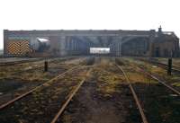 The north end of the former 10 road straight through shed at 56A Wakefield, photographed on 2 March 1991. The shed, which had an allocation of over 120 steam locomotives in the 1950s, officially closed in June 1967, although part of the building was subsequently put to use as a wagon repair facility, an activity that continued until 1986. The structure was finally demolished in 1993.<br>
<br><br>[David Pesterfield 02/03/1991]