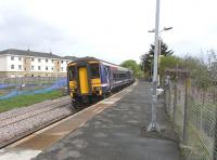 156 449 about to leave Stewarton with a Glasgow - Kilmarnock service on 7 May 2009. The redoubled track is already in place here, as it is right back to Lugton, in readiness for the planned twice-hourly service on the line from December 2009.At Dunlop the second platform is substantially complete with even platform lighting in place, but here work has barely started.However, a white-tiled subway to the platform has recently been re-exposed. <br>
<br><br>[David Panton 07/05/2009]