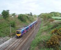 Heading north though the cutting at Forton is Trans Pennine unit 185147. Forton lies mid way between Scorton and Bay Horse but the village never had its own station. This view is from Cleveley Bank Lane bridge towards Bay Horse and Lancaster.<br><br>[Mark Bartlett 09/05/2009]