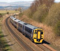 A six car 158 set on an Aberdeen - Glasgow working, photographed near Plean on 5 April 2009. The first set is in transitional blue livery. <br>
<br><br>[Brian Forbes 05/04/2009]