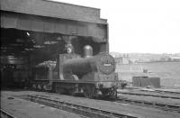 A quiet day at 26E Lees (Oldham) shed, on 20 May 1960, with Lancashire & Yorkshire Railway <I>A class</I> locomotive 52207 simmering in the yard. The locomotive was withdrawn the following year with Lees shed, located on the Oldham to Greenfield line - goods only by this time - finally closing in 1964. <br><br>[K A Gray 20/05/1960]
