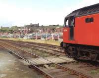 47704 stands at Bog Hall sidings and foot crossing, Whitby, in July 1993 having brought in a special earlier. The historic Whitby Abbey, founded in 657 AD, looks over the proceedings from its position high on Whitby's East Cliff in the background.<br>
<br><br>[David Pesterfield /07/1993]