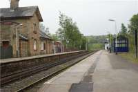 Chapel-en-le-Frith station looking towards Buxton on 13 May 2009. The station building on the Buxton platform is now the Brief Encounter restaurant. There is no footbridge between the platforms and access between them is by way of the foot crossing behind the photographer.<br><br>[John McIntyre 13/05/2009]