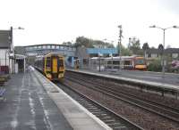 Most services from Dunblane originate there, having arrived from <br>
Edinburgh (twice an hour) or Glasgow (hourly). They all arrive at the outside platform, which would be 3 but no number is displayed, run forward to reverse in the stub, then enter Platform 1 to start the return journey south. Platform 2 serves the few northbound services which stop here, although these will increase when the proposed hourly stopping service from Glasgow to Perth is introduced.The station is seen looking south on a wet 5 May as a 158 waits to return to Edinburgh while a 170 has just arrived from Glasgow. <br>
<br><br>[David Panton 05/05/2009]