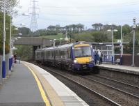 A train bound for Glasgow Queen Street formed by 170 426 calls at Croy on 29 April.<br><br>[David Panton 29/04/2009]