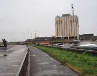 With the demolition of the old station toilets the only surviving remnants of Blackpool Central are a brick wall on Central Drive, where the old excursion platforms were sited, and this low blue brick retaining wall overlooking Bonney St Market. This wall and path follow the line of the former Platform 1 at Central looking towards the old station <I>throat</I> and Blackpool South. The large building is Blackpool Police Station, part of which is built on former railway land. <br><br>[Mark Bartlett 05/05/2009]