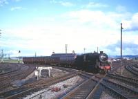 Black 5 no 45028 brings a train from Edinburgh Princes Street into Carstairs station in the early 1960s.<br><br>[Robin Barbour Collection (Courtesy Bruce McCartney) //]