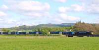 A DRS class 66 with <I>Stobart Rail</I> Inverness empty containers passing south through Forteviot on 12 May 2009<br><br>[Brian Forbes 12/05/2009]