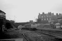 A Swindon Cross Country unit passes the old Kittybrewster station as it heads towards Aberdeen through the Denburn. In the background is Great Northern Road while on the left stands the boarded up Kittybrewster South SB. The photograph was taken from the end of the up platform which, by late 1972, had lost its track. <br><br>[John McIntyre /11/1972]