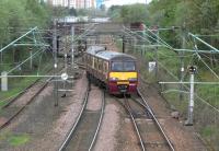 Manoeuvres at Yoker, with 320 320 about to enter the network after picking its way out of the depot on 2 May 2009.<br><br>[David Panton 02/05/2009]