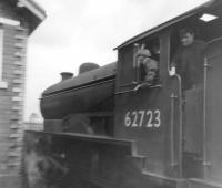 <I>An early Pesterfield!</I> Grab shot taken on a Box Brownie through  the windscreen of parent's Ford Prefect, around 1959, believed to be at Flamborough level crossing, near Bridlington. On the crossing is Gresley D49 4-4-0 no 62723 <I>Nottinghamshire</I> of 53B Hull (Botanic Gardens) shed. The <I>Shire</I>, built at Darlington works in 1928, was eventually cut up in the  adjoining scrapyard there some 33 years later in January of 1961. <br>
<br><br>[David Pesterfield //1959]