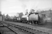 The morning sun catches J38 no 65915 as it prepares to leave Leslie in 1966 with a rake of empty wagons for Thornton yard via Markinch. [See image 27713] <br><br>[Robin Barbour Collection (Courtesy Bruce McCartney) //1966]