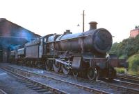 Ex-GWR Grange class 4-6-0 no 6815 <i>Frilford Grange</i>, minus nameplate and other removables, photographed on shed at 85A Worcester in August 1965 alongside a pair of GWR pannier tanks. The locomotive was withdrawn from Severn Tunnel Junction (86E) some 3 months later and cut up at Buttigiegs, Newport, in January of 1966.<br><br>[Robin Barbour Collection (Courtesy Bruce McCartney) 08/08/1965]