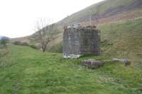 View south towards Tweedsmuir along the trackbed of the Talla Railway by the Crook Inn. Remains of the locomotive servicing facilities still stand a century after the line was lifted, although there is no trace of the wooden platform built here in 1899 by contractor John Best. The pillar on the skyline marks the route of the 35 mile long subterranean <I>Talla Aqueduct</I>, constructed between 1895 and 1905, which continues to supply millions of gallons of water each day  to the City of Edinburgh.<br><br>[John Furnevel 25/04/2009]