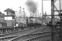 47474 leaves a cloud of exhaust over Ferryhill box on 25 May 1975 as it passes under the adjacent signal gantry with the 1015 hrs train to Edinburgh, shortly after leaving Aberdeen station.<br><br>[John McIntyre 25/05/1975]