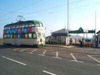 Blackpool <I>Balloon Car</I> No. 712, dating from the 1930s and still in broadly original condition, pulls up at Fleetwood Ferry Terminal on a driver training run. The passenger ferry for Knott End, only a short distance away across the Wyre Estuary, is now operating regularly again and leaves from a jetty just through the arch by the tram stop. <br><br>[Mark Bartlett 29/05/2009]