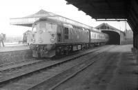 D5323 prepares to take the <i>Formartine and Buchan Railtour</i> out of Peterhead on 24 May 1969. Passenger services were withdrawn in 1965, although freight operations at the busy fishing port continued for a further 5 years. Nothing of the railway remains here today, with the site now occupied by Peterhead Academy [see image 17391].<br>
<br><br>[Robin Barbour Collection (Courtesy Bruce McCartney) 24/05/1969]