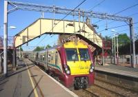 Lanark bound 334 030 calls at Uddingston on 29 May 2009.<br><br>[John Steven 29/05/2009]