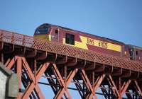 EWS 67025 <I>Western Star</I> brings an evening Edinburgh-Fife commuter train over the Forth Bridge on 1 June 2009.<br>
<br><br>[Bill Roberton 01/06/2009]