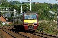 320306 heads west from Cardross towards Geilston LC on 30 May 2009 with a service for Helensburgh Central.<br><br>[John McIntyre 30/05/2009]