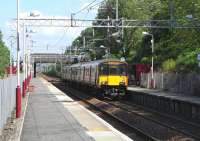 318 266 with a stopping service to Gourock arrives at Bogston on 1 June 2009. Those familiar with the area between Port Glasgow and Greenock will know the leafiness depicted here is deceptive.<br><br>[David Panton 01/06/2009]