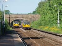 The former Huncoat Colliery access bridge, just beyond Huncoat's platforms, sees two Pacers cross while rostered on East Lancs line services. In my early years, until 1964, I lived opposite the colliery entrance and remember WD 2-8-0s clanking under this bridge on coal trains and NCB liveried AEC 8 wheel lorries growling over it loaded with coal.<br><br>[Mark Bartlett 01/06/2009]