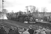 77003+76049 stand at Barnard Castle on 20 January 1962 with the 9 coaches of <I>The Stainmore Limited</I>, commemorating the end of operations over the Stainmore route.<br><br>[K A Gray 20/01/1962]