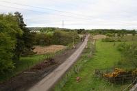 Looking east toward Bathgate in May 2009. In the middle distance, a junction existed connecting several lines to the pits in the Torbane coalface (roughly where the J4M8 business park is now). A further line looped back and joined the mainline near Armadale. Another junction existed to serve the mine at Bathville, to the north of the mainline.<br><br>[James Young 23/05/2009]