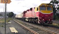 Melbourne-bound train headed by N Class N 468 runs into Kilmore East Station, Victoria on 28th May 2009. This is on the broad gauge (5' 3') and to the right can be seen the standard gauge line from Sydney to Melbourne which runs parallel here. The stationmaster / signalman operated the colour light signals with a full-size lever frame. He said thatthis linewas one of the last places in the world to use the double - block system of working. Until the bushfires in February which caused damage to the area and the closure of the line, the levers had controlled lower-quadrant semaphores.<br>
<br><br>[Colin Miller 28/05/2009]