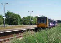 <I>Next train in quite a while</I>. The 1209 to Blackpool South, formed by 142013, stops at Salwick. The other westbound trans are at 0707, 0809 and 1609. The sparse Preston bound service comprises the 0713, 0813 and 1615 trains. Until the station became unstaffed in the early 70s Salwick was locally famous for its wishing well on the platform.<br><br>[Mark Bartlett 02/06/2009]