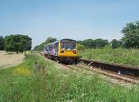 142013 pulls away from a stop at Salwick, past the disused western end of the platform. Although the station opened in the 1840s it has a distinctive L&YR island platform that I suspect was built when the Preston to Kirkham line was quadrupled.<br><br>[Mark Bartlett 02/06/2009]