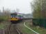 Northern Pacer 142013 squeals round the tight curve beyond the platform to cross Burnley viaduct on the short sharp climb up to Burnley Barracks and Gannow Junction near Rose Grove.<br><br>[Mark Bartlett 16/04/2009]