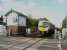 Between Blackpool and Poulton, just east of Layton station, is the block post signal box at Carleton, which also covers a very busy level crossing. The signals at Carleton Crossing are still semaphores, one of which can just be seen alongside 185129 working a Transpennine Blackpool North to Manchester Airport service.<br><br>[Mark Bartlett 12/05/2009]