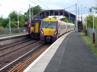 East and westbound services meet at Belllshill on 9 June with 334 039 heading for Lanark.<br><br>[John Steven //]