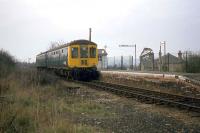 The Marks Tey to Sudbury line has done very well to survive for over 40 years since closure of the Sudbury-Cambridge section in March 1967. Shown here in April 1978 is the station at Bures with a Cravens/Gloucester hybrid DMU about to depart for Sudbury. To guarantee survival, the branch really needs a London facing junction at Marks Tey instead of the present one that faces Colchester. If built, electrification and through London services would surely follow.<br><br>[Mark Dufton 11/03/1978]