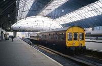 Inspection saloon 45030 accompanied by an Inter City liveried Class 47 loco is an unusual morning visitor to Glasgow Queen Street in July 1987. In the background are a Class 27 loco and a Class 47 Push-Pull set that has just arrived from Dundee.<br><br>[Mark Dufton /07/1987]