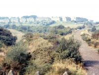 View west from Castle Douglas in September 1973 with the station site behind the photographer. To the right is the route of the former line to Stranraer, while to the left is the trackbed of the Kirkcudbright branch. <br><br>[Colin Miller /09/1973]