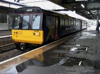 142068 having recently arrived at Paignton waits to return to Exemouth on a very wet Saturday afternoon.<br><br>[John McIntyre 06/06/2009]