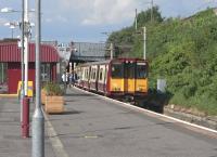 Teatime on a hot June day at Pollokshields East and all windows are open as 314205 for Neilston takes commuters home.<br><br>[David Panton 01/06/2009]