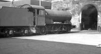 Gresley J39 0-6-0 no 64877 spent almost its whole life at Carlisle Canal shed. It is seen standing outside the roundhouse there around 1960. Canal shed closed in the summer of 1963. Nothing remains.<br>
<br><br>[K A Gray //1960]