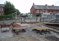 The Fleetwood branch is one of those identified by the Train Operating Companies as suitable for reopening as part of the national network. This is the view south from Thornton-Cleveleys platform showing the level crossing and an area cleared by the local railway society, who have also made a feature of the former signal box foundations, just in front of the garden bench. <br><br>[Mark Bartlett 10/06/2009]