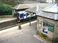 Looking over the east end of Knaresborough station on 24 April 2009. A Northern trains service for Leeds awaits its departure time at platform 1 as a customer visits <I>Fireplaces of Yesteryear</I> on platform 2.<br>
<br><br>[John Furnevel 24/04/2009]