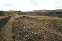 The remnants of the signal box at Stobs on 3 March 2006. Situated on the up side of the <i>Waverley route</i> the box also controlled the sidings at Stobs Yard part of which is just visible to the extreme left. The mainline solum is visible to the left. Amongst the general remains, part of the cabin's chimney pot rests atop a small pile of debris.<br><br>[James Young 03/03/2006]