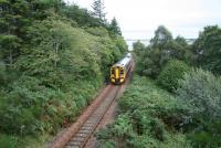 A southbound 158 with the afternoon service from the far north turns inland after skirting the shore of Loch Fleet on 29 August 2007. The train is about to pass through the former junction for Dornoch at The Mound (closed 1960) before taking the route via Lairg and the Oykel Viaduct [see image 16500].<br><br>[John Furnevel 29/08/2007]