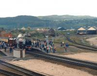 46229 <I>Duchess of Hamilton</I> makes a water stop at Llandudno Junction with the Holyhead bound <I>Ynys Mon Express</I> on 4 May 1991. Railfreight grey liveried 47107 can be seen stabled by the carriage siding to the right of view [See image 27784] <br><br>[David Pesterfield 04/05/1991]