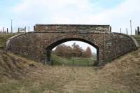 Overbridge leading to Cowbraehill farm, between Falahill and Tynehead looking North. This 1849 structure is due for demolition as part of the <i>Waverley line</i> reconstruction. As of May 2009, a temporary road had been constructed to serve Cowbraehill in the interim. A new structure is due to be built here.<br><br>[James Young 14/03/2007]