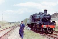 Scene at Aviemore Speyside in 1979. Neil Clark acting as fireman clutching the token, with the Ivatt about to return to Boat.<br><br>[Colin Miller //1979]