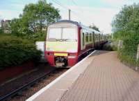 320301 pulls away from the platform at Airdrie on 16 June on the last leg of its journey to Drumgelloch.<br><br>[John Steven 16/06/2009]